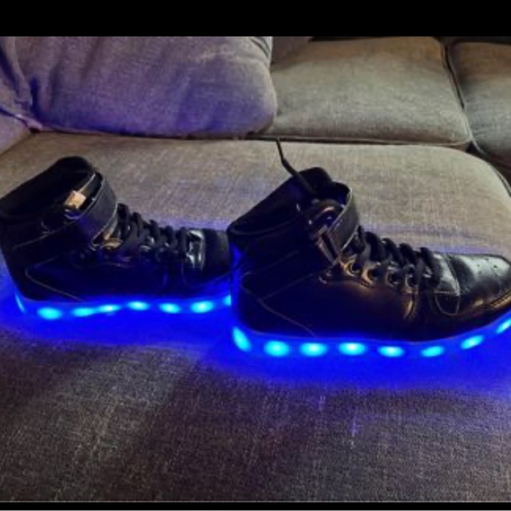 Black pleather sneakers.  Really soft with lights
